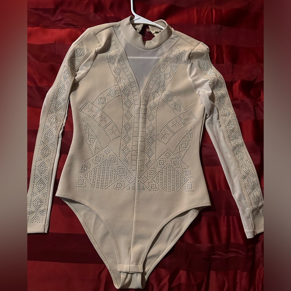 New never worn Bodysuit. Cream colored. Size small.